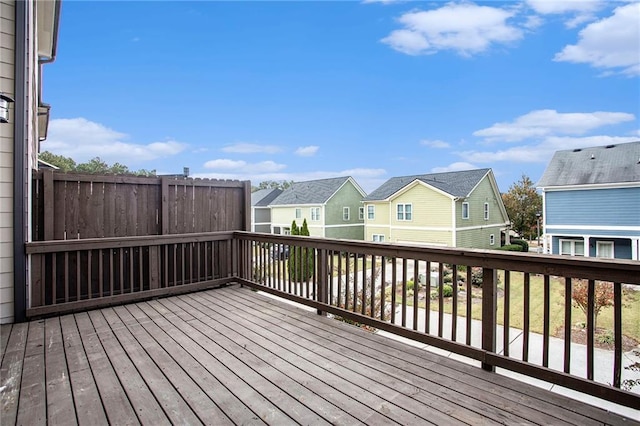 wooden terrace with a residential view