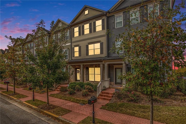 townhome / multi-family property with covered porch