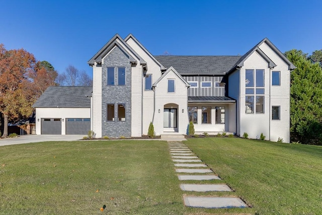 view of front of house featuring a garage and a front lawn