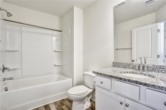 full bath featuring toilet, shower / washtub combination, wood finished floors, and visible vents