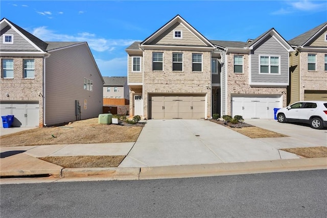 view of property featuring driveway, an attached garage, and central air condition unit