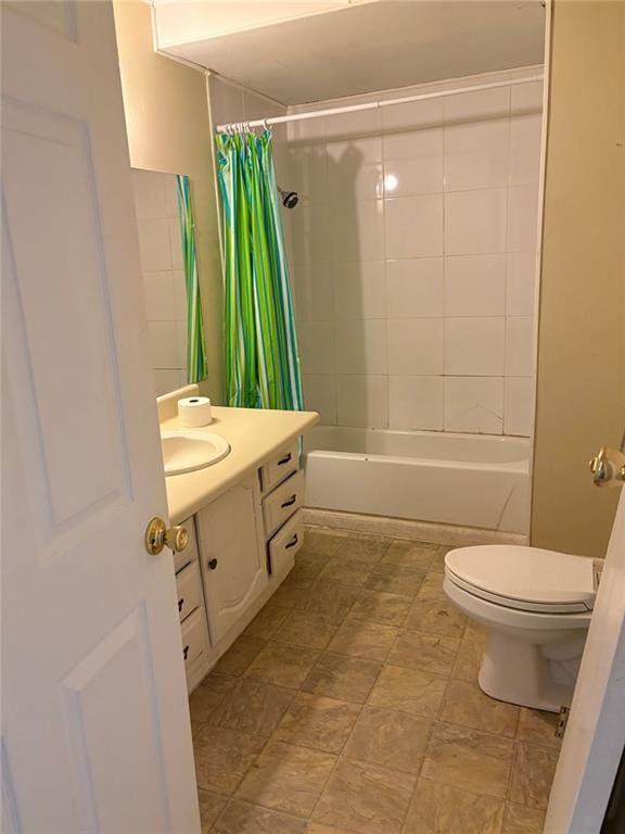 full bath featuring shower / bathtub combination with curtain, toilet, and vanity