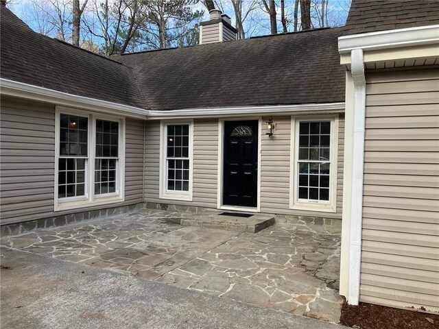 property entrance with a patio