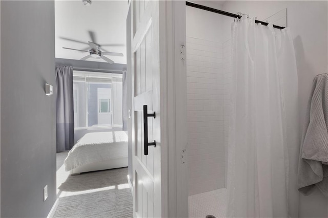 full bath featuring tiled shower, ensuite bathroom, and ceiling fan