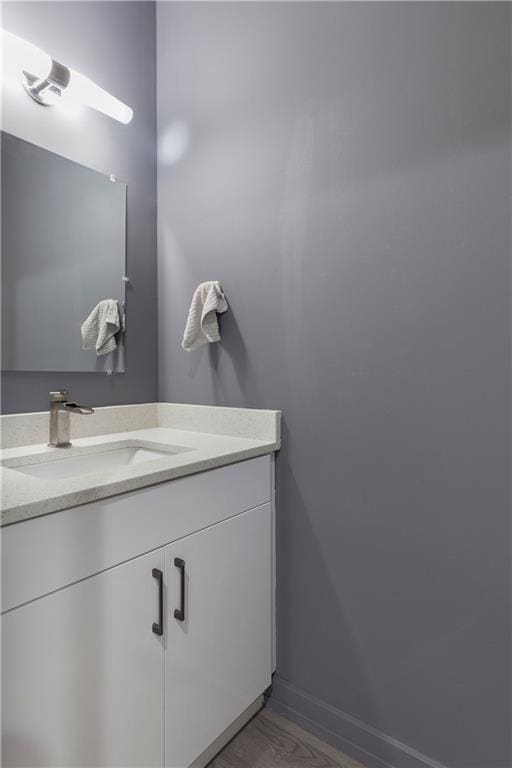bathroom featuring vanity and baseboards