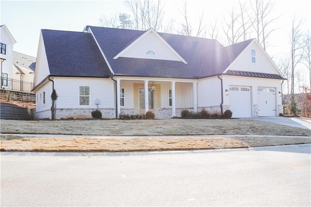 view of front of home with a garage and a porch