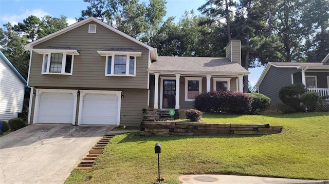 tri-level home with a front lawn and a garage