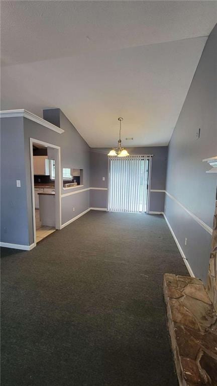 unfurnished living room featuring an inviting chandelier, lofted ceiling, and carpet