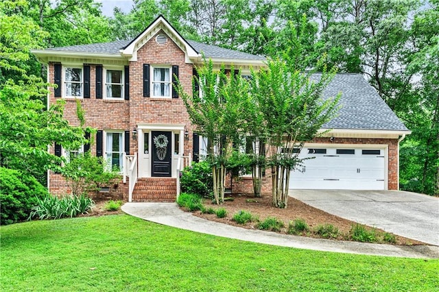 135 Crimson Rdg, Tyrone, GA 30290 - colonial-style house featuring a front yard, concrete driveway, an attached garage, brick siding, and roof with shingles