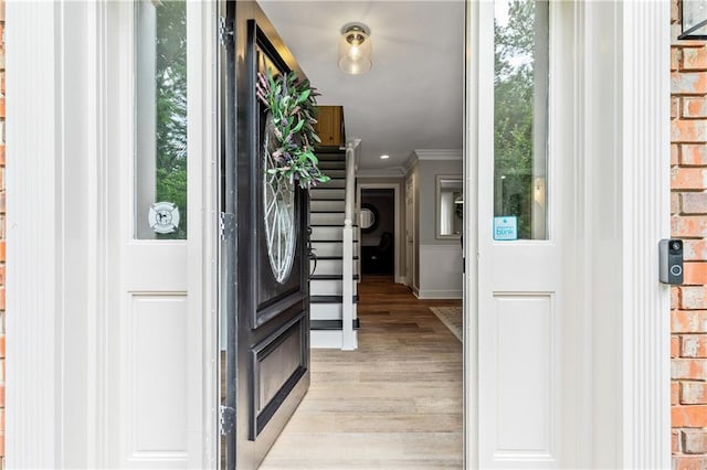 135 Crimson Rdg, Tyrone, GA 30290 - entrance foyer with light wood-style flooring, crown molding, and baseboards