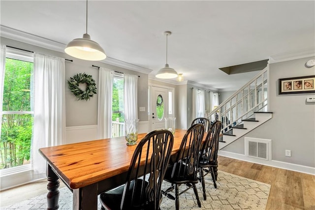135 Crimson Rdg, Tyrone, GA 30290 - dining space with plenty of natural light, crown molding, stairway, wood finished floors, and baseboards
