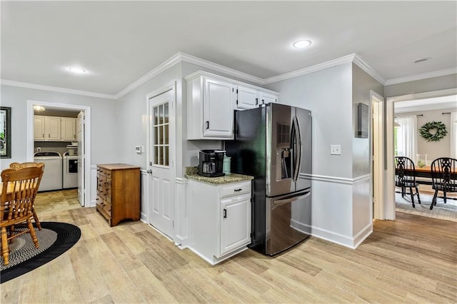 135 Crimson Rdg, Tyrone, GA 30290 - kitchen featuring stainless steel fridge with ice dispenser, light wood finished floors, washer and dryer, ornamental molding, and white cabinets