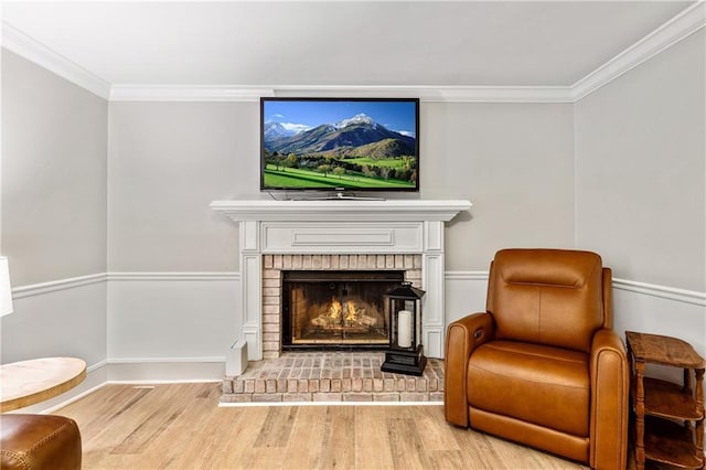 135 Crimson Rdg, Tyrone, GA 30290 - sitting room with wood finished floors, ornamental molding, and a brick fireplace