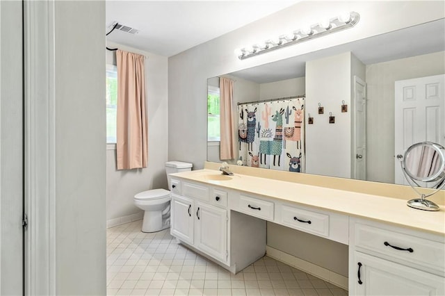 135 Crimson Rdg, Tyrone, GA 30290 - bathroom featuring vanity, toilet, baseboards, and tile patterned flooring