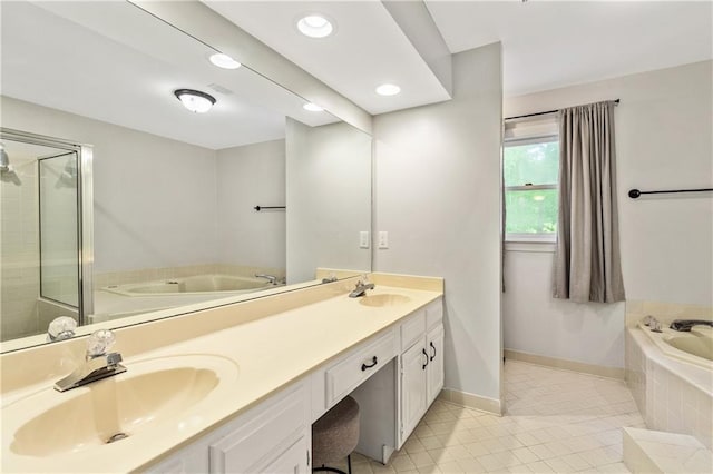135 Crimson Rdg, Tyrone, GA 30290 - bathroom with a bath, tile patterned floors, double vanity, baseboards, and recessed lighting