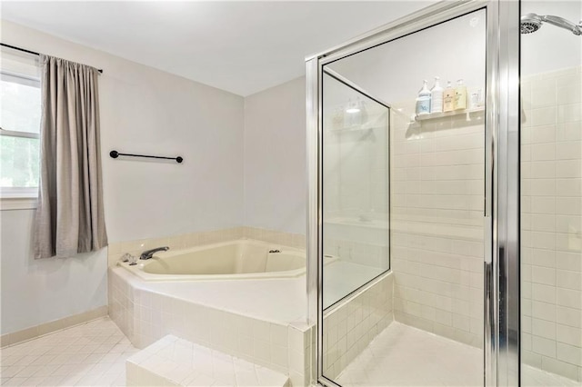 135 Crimson Rdg, Tyrone, GA 30290 - bathroom with a stall shower, a bath, tile patterned flooring, and baseboards