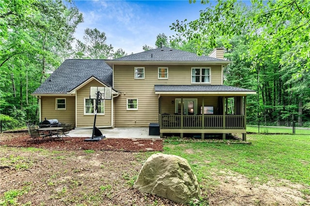 135 Crimson Rdg, Tyrone, GA 30290 - rear view of house with a chimney, a patio area, and roof with shingles