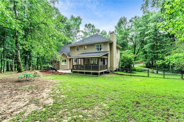 135 Crimson Rdg, Tyrone, GA 30290 - back of property with a chimney and a shingled roof