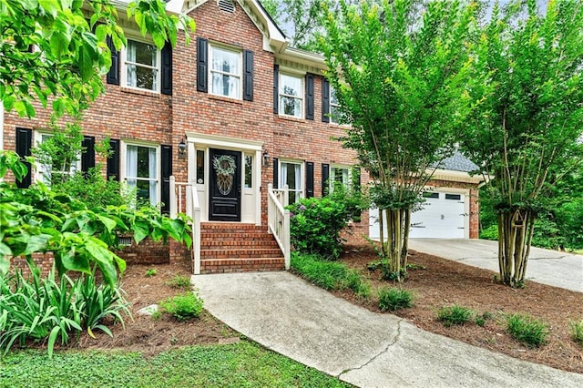 135 Crimson Rdg, Tyrone, GA 30290 - colonial inspired home featuring brick siding, driveway, and a garage