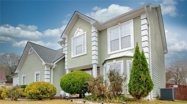 view of home's exterior with central AC unit