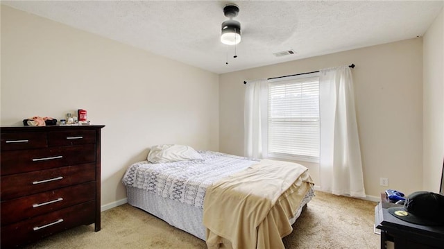bedroom featuring ceiling fan and light colored carpet