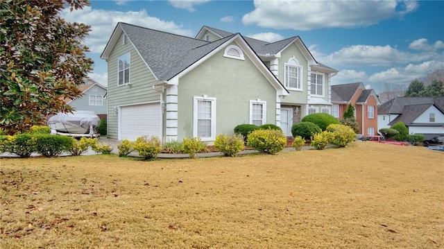 front facade featuring a garage and a front lawn