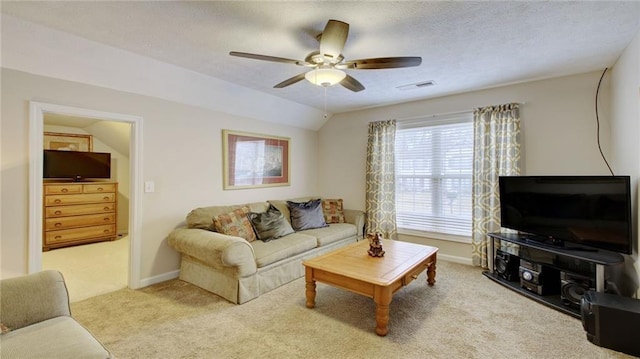 living room featuring light carpet, vaulted ceiling, and ceiling fan