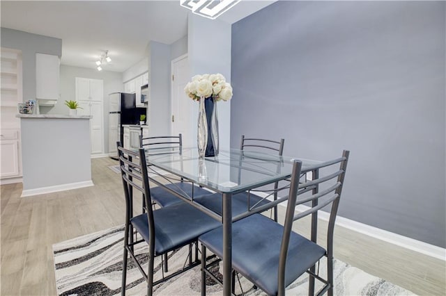 dining area featuring light hardwood / wood-style floors