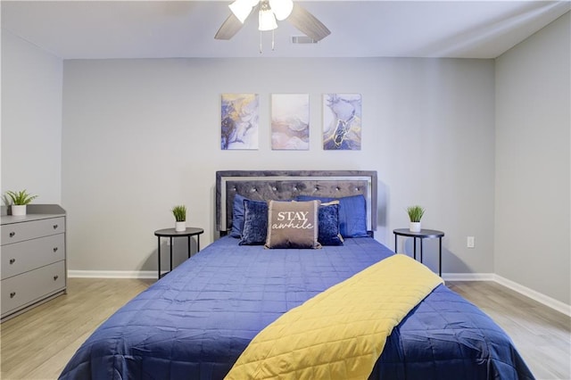 bedroom featuring light hardwood / wood-style flooring and ceiling fan