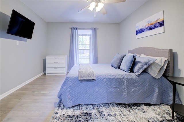 bedroom featuring hardwood / wood-style flooring and ceiling fan