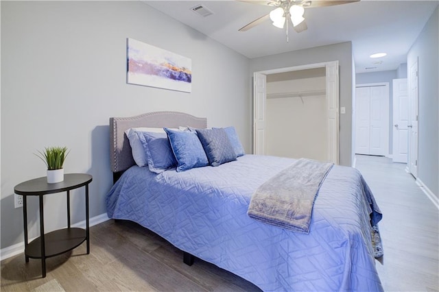 bedroom featuring wood-type flooring and ceiling fan