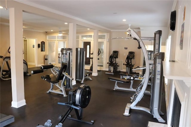 workout area with ceiling fan and ornamental molding