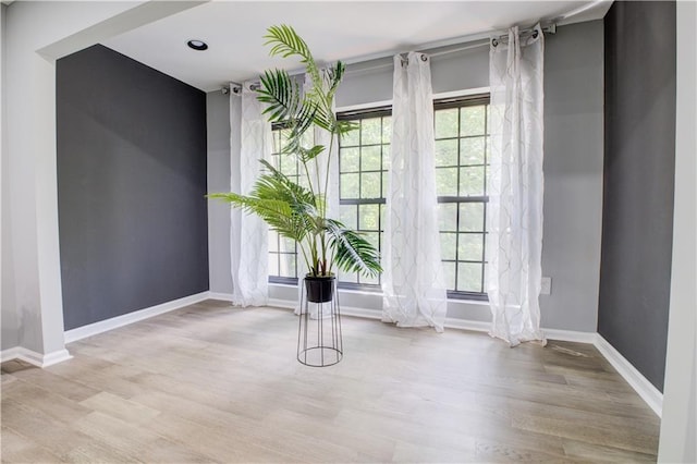 unfurnished room featuring light hardwood / wood-style flooring