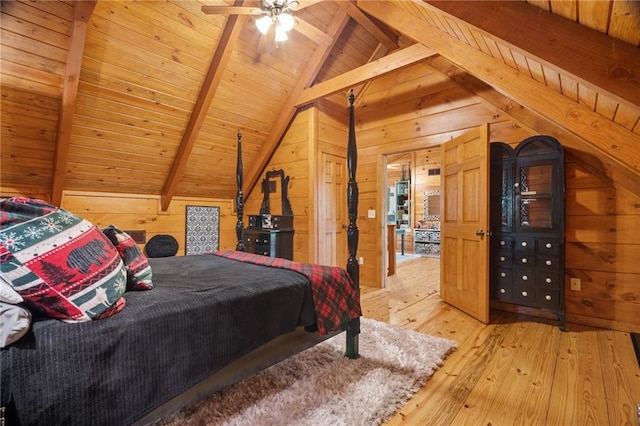 bedroom featuring wooden walls, wooden ceiling, vaulted ceiling with beams, and light wood-type flooring