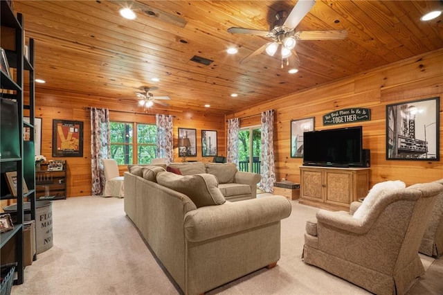 living room with wood ceiling, ceiling fan, wood walls, recessed lighting, and a wealth of natural light