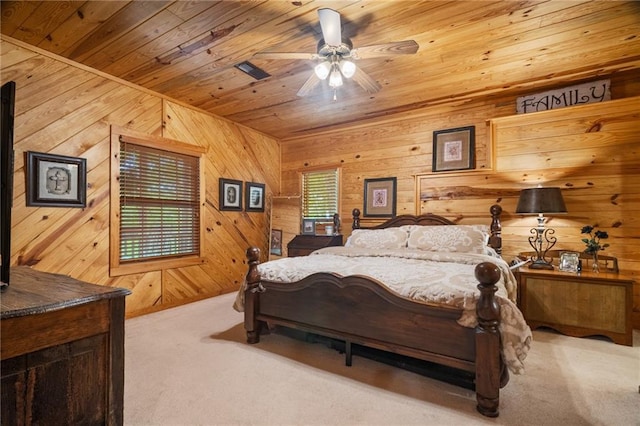 bedroom featuring carpet floors, wooden walls, and wooden ceiling