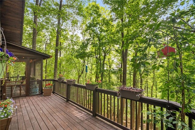 wooden terrace with a sunroom