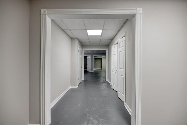 corridor featuring a drop ceiling