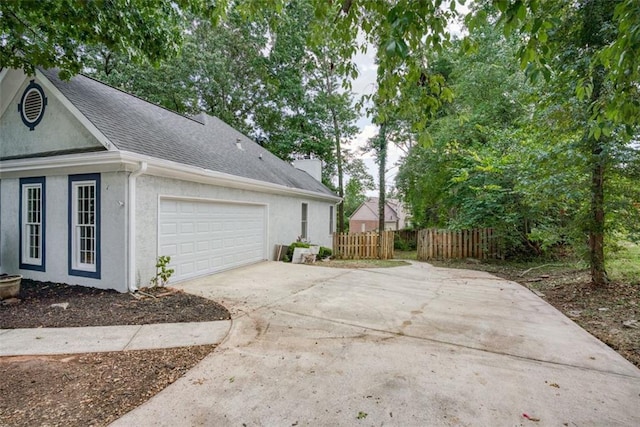 view of property exterior featuring a garage