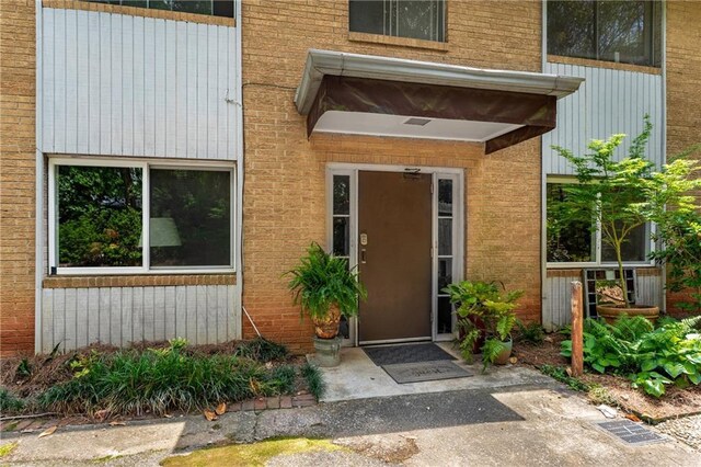 148 Waverly Way Unit 10, Atlanta, GA 30307 - view of building exterior featuring an attached garage