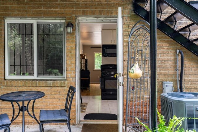 148 Waverly Way Unit 10, Atlanta, GA 30307 - property entrance with cooling unit and brick siding