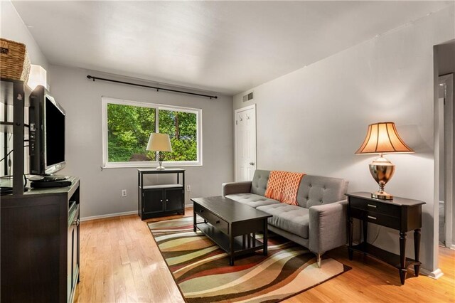 148 Waverly Way Unit 10, Atlanta, GA 30307 - living room with baseboards, light wood finished floors, and visible vents