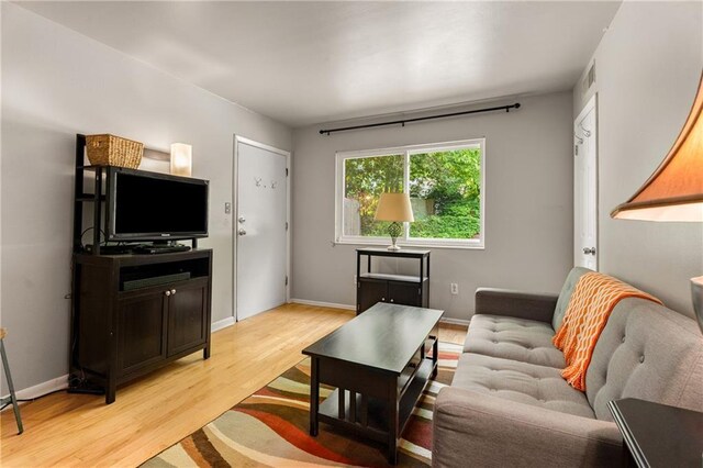 148 Waverly Way Unit 10, Atlanta, GA 30307 - living area with baseboards, light wood-style flooring, and visible vents