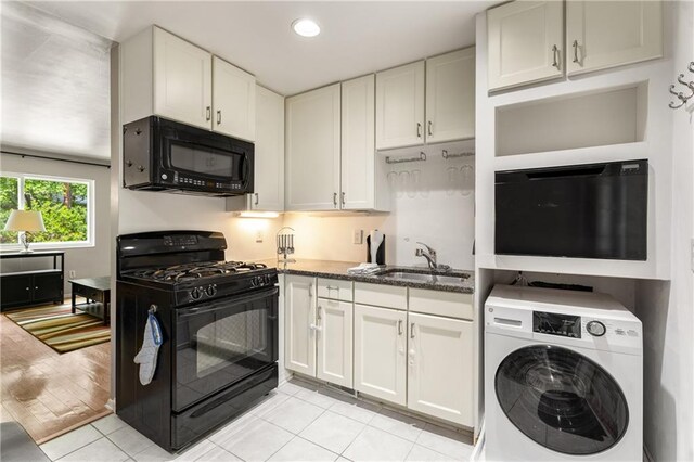 148 Waverly Way Unit 10, Atlanta, GA 30307 - kitchen with white cabinets, a sink, washer / clothes dryer, light tile patterned floors, and black gas range