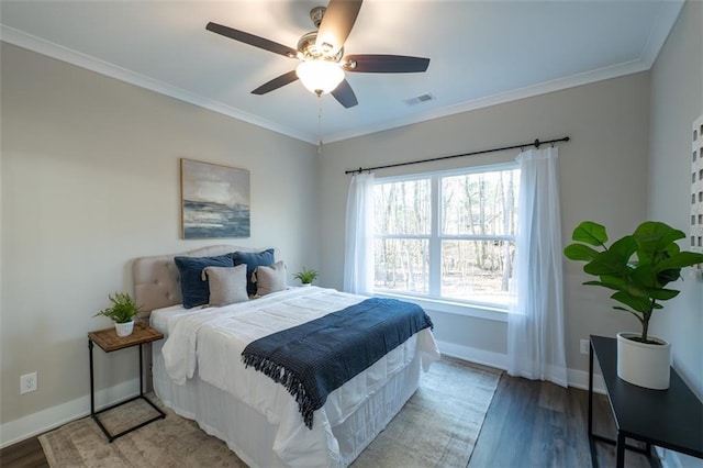 bedroom featuring hardwood / wood-style floors, ceiling fan, and ornamental molding