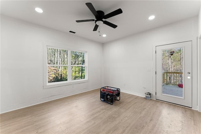 unfurnished room featuring recessed lighting, baseboards, and wood finished floors