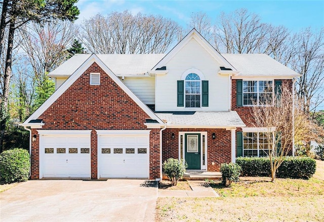 traditional home featuring brick siding, concrete driveway, and an attached garage