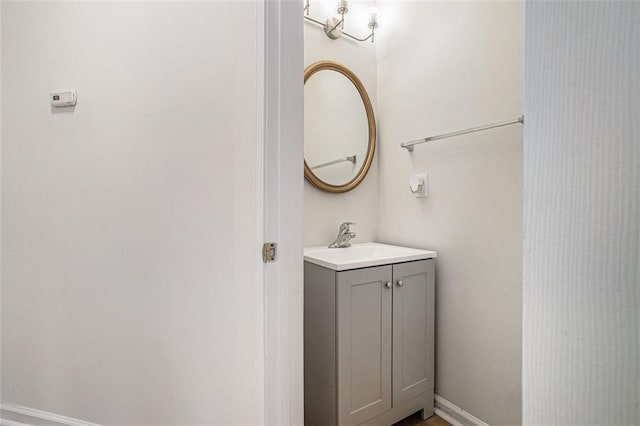 bathroom with vanity and baseboards