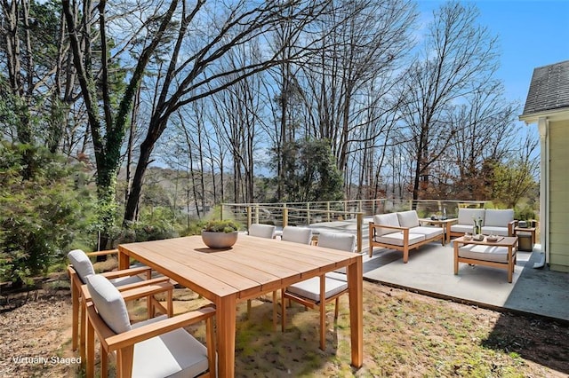 exterior space featuring outdoor dining area and outdoor lounge area