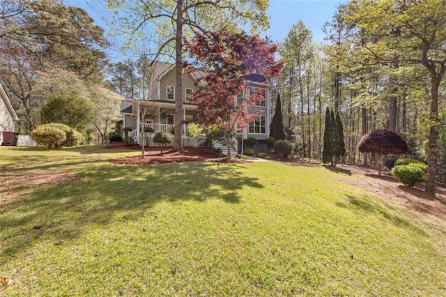 view of yard with covered porch